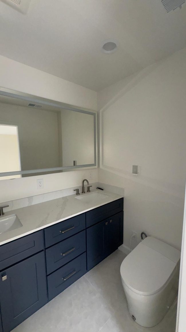 A fresh, modern bathroom with a clean white paint