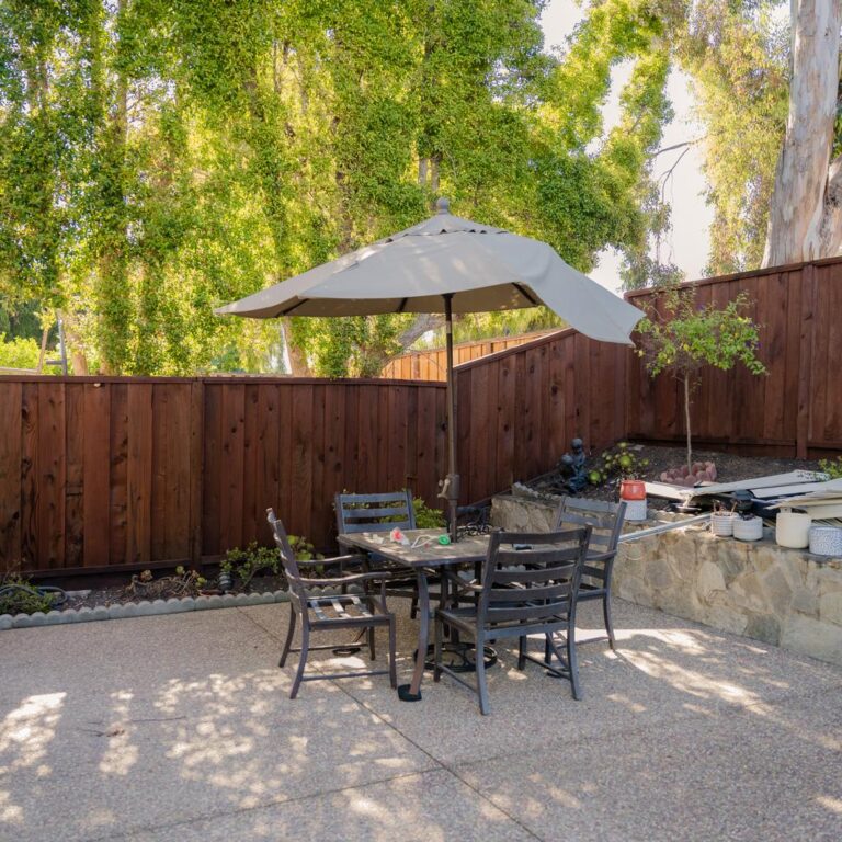 Power washed and stained outdoor fence in a Bay Area residential area