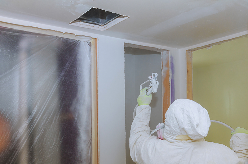 Certified Bay Area painter removing the popcorn ceiling texture from a home.